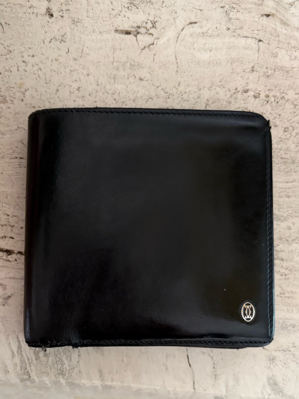 Cartier Black Leather Bi-Fold Wallet with Silver Emblem